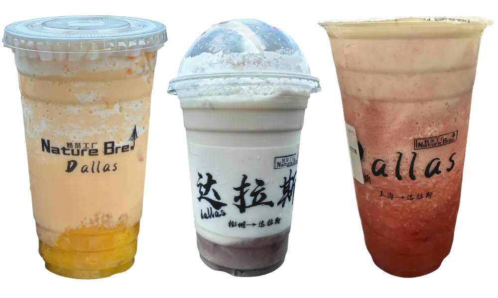 Three assorted bubble tea cups displayed at Nature Brew, a Bubble Tea Store in Plano.